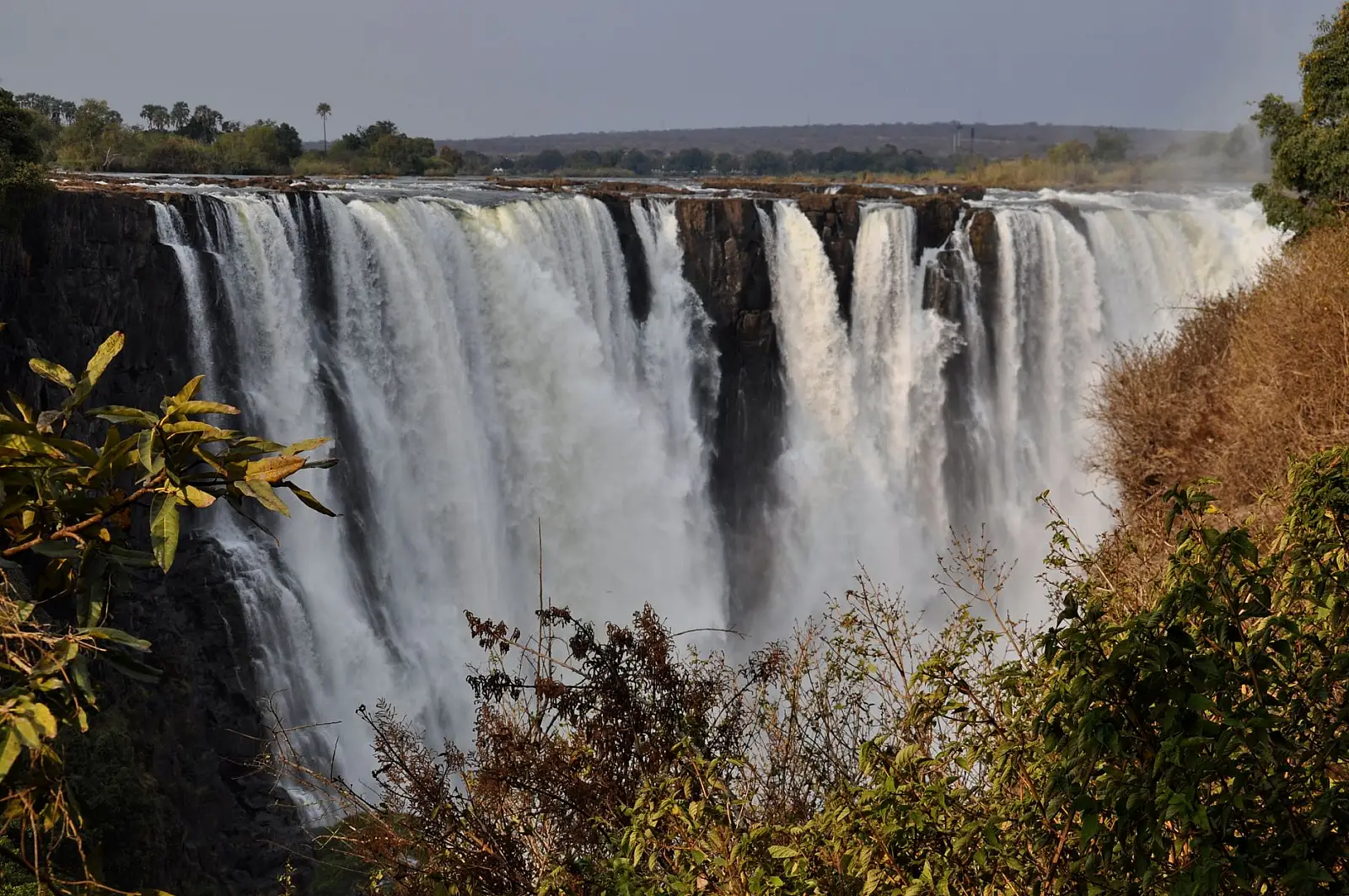 On the Zambezi River inside Mosi-oa-Tunya National Park, Livingstone, Zambia — guests have free access to the falls via the hotel's own private entrance, about a 5-minute walk
